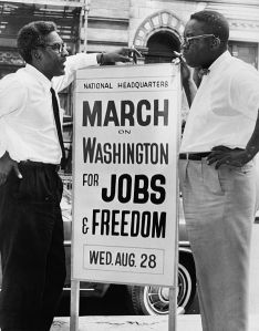 1963: In front of 170 W 130 St., March on Washington, [l to r] Bayard Rustin, Deputy Director, Cleveland Robinson, Chairman of Administrative Committee